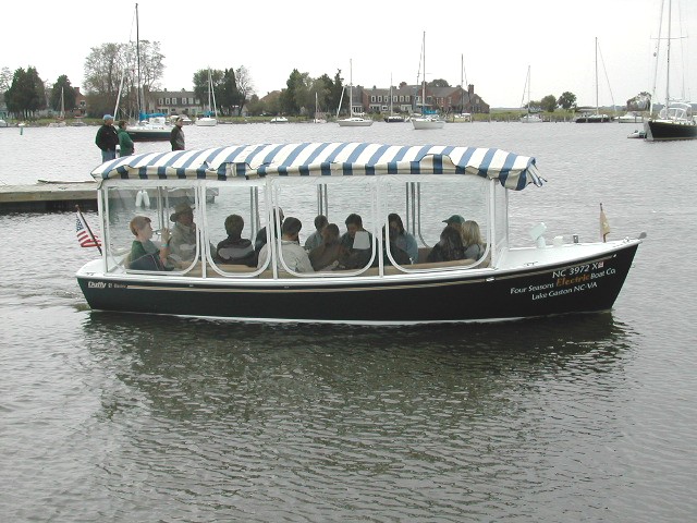 electric boat landing four seasons electric boats at dockside landing on lake electric boat landing four seasons electric boats at dockside landing on lake